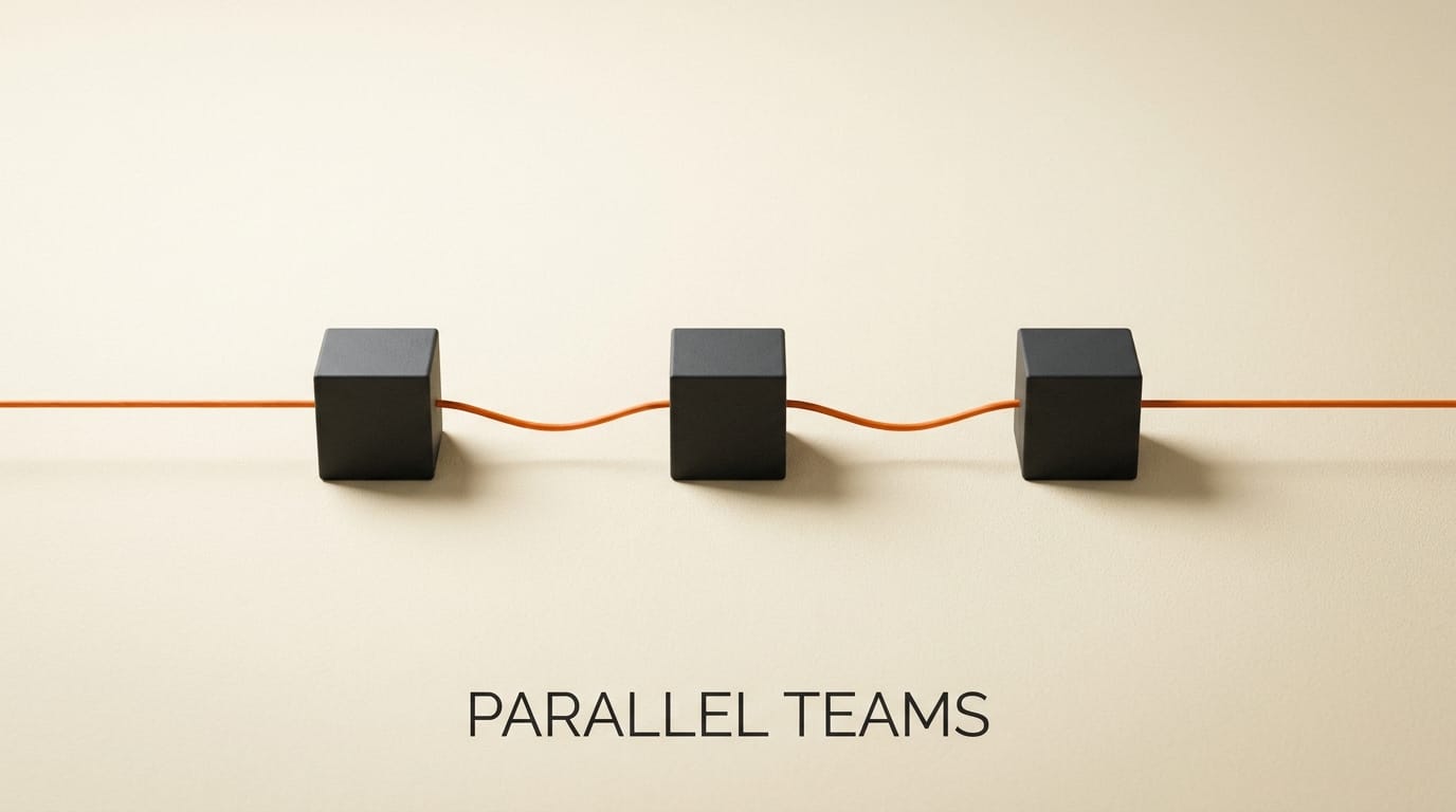 Three charcoal cubes connected by an orange filament representing parallel multi-agent teams.